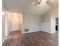 Neutral living room featuring hardwood floors, gray walls, and a front door entrance at 20 Rosebud Ln, Mcdonough, GA 30253
