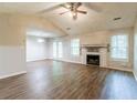 Spacious living room features hardwood floors, a fireplace, and French doors to the outside at 20 Rosebud Ln, Mcdonough, GA 30253