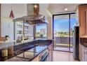 Modern kitchen featuring stainless steel appliances, granite countertops, and city views at 2575 Peachtree Ne Rd # 15G, Atlanta, GA 30305