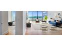Stylishly furnished living room offering abundant natural light and an open floor plan at 2575 Peachtree Ne Rd # 15G, Atlanta, GA 30305