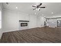 Open floor plan showcasing a modern fireplace and a well-equipped kitchen with stainless steel appliances at 3382 Monarch Ave, Duluth, GA 30096