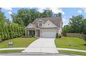 Lovely home with a manicured lawn and an attached garage, providing a welcoming curb appeal at 3392 Fall Branch Ln, Buford, GA 30519