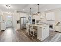 Bright kitchen featuring granite countertops, stainless steel appliances, and a central island with seating at 3392 Fall Branch Ln, Buford, GA 30519