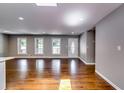Bright, open living area featuring hardwood floors, neutral paint, and large windows at 3122 Vandiver Dr, Marietta, GA 30066