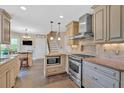 The kitchen features custom cabinets, stainless steel appliances, and a cozy breakfast nook at 3473 Whisperwood Nw Ct, Marietta, GA 30064