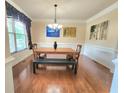 Formal dining room features hardwood floors and decorative trim work at 827 Autry Oak Ct, Johns Creek, GA 30022