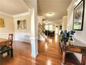 Spacious, open-concept living area featuring hardwood floors and elegant trim work at 827 Autry Oak Ct, Johns Creek, GA 30022
