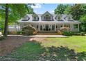 Beautiful home with a large front yard and inviting front porch at 1824 Mount Paran Nw Rd, Atlanta, GA 30327