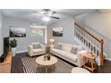 Beautifully furnished living room with modern decor, hardwood floors, and neutral paint at 3458 Carriage Chase Rd, Atlanta, GA 30349