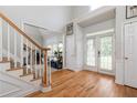 Spacious foyer with hardwood floors, tall ceilings, and double doors at 2693 Blairsden Nw Pl, Kennesaw, GA 30144
