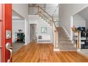 Inviting foyer with hardwood floors, staircase, and lots of natural light at 2693 Blairsden Nw Pl, Kennesaw, GA 30144