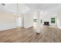 Spacious living room featuring new floors, a fireplace, and ample natural light at 910 Laurel Cove Dr, Snellville, GA 30078