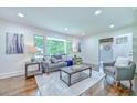 Cozy living room featuring hardwood floors, large window, and comfortable seating at 2011 Lexington Ave, Atlanta, GA 30344
