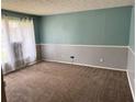 Carpeted living room with two-toned walls at 1807 Ashborough Se Cir # B, Marietta, GA 30067