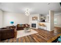 Cozy living room featuring hardwood floors, a fireplace, and seating area at 920 Society Sw Cir, Atlanta, GA 30331