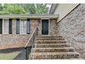 Inviting brick front porch and entry of this charming two-story home at 4444 Lisa Nw Way, Lilburn, GA 30047