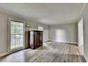 Light filled living room features hardwood floors and neutral paint at 4444 Lisa Nw Way, Lilburn, GA 30047