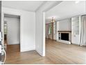 Bright living room featuring hardwood floors and a fireplace with custom built-ins at 2676 Cottonwood Dr, Marietta, GA 30066