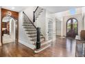 Grand foyer with hardwood floors and curved staircase at 1155 Admiral Xing, Alpharetta, GA 30005