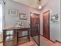Welcoming entryway with hardwood floors, a desk, and framed artwork for a warm, inviting ambiance at 629 Silver Trace Ct, Woodstock, GA 30189