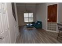 This living room has a high ceiling, ceiling fan, a bright window, and a stylish blue sofa at 400 17Th Nw St # 2412, Atlanta, GA 30363