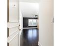 View of the bedroom featuring hardwood floors, and black accent wall at 199 14Th Ne St # 412, Atlanta, GA 30309