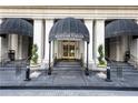 Mayfair Tower entrance featuring a covered entry and elegant stone steps at 199 14Th Ne St # 412, Atlanta, GA 30309