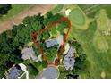 Aerial view showing property boundaries, mature trees, and proximity to golf course at 2202 Lattimore Farm Nw Dr, Kennesaw, GA 30152