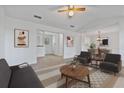 Bright living room featuring neutral tones, a ceiling fan, and ample space for relaxation and entertaining at 2209 N Forest Trl, Atlanta, GA 30338