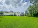 Expansive backyard view with a deck perfect for outdoor entertaining and enjoying the peaceful surroundings at 4017 S South Bogan Road Rd, Buford, GA 30519