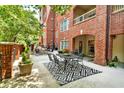 A lovely patio area with an outdoor dining table and cozy seating, perfect for relaxing or entertaining at 211 Colonial Homes Nw Dr # 1102, Atlanta, GA 30309