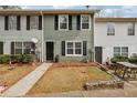 Townhouse exterior showcasing a well-kept lawn, sidewalk, and tidy landscaping at 4282 Worth Nw St, Acworth, GA 30101