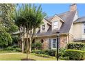 A view of the front exterior angle with manicured lawn and attractive landscaping at 1508 Brianwood Rd # 1508, Decatur, GA 30033
