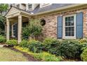 Charming brick home with a beautiful manicured lawn and colorful landscaping at 1508 Brianwood Rd # 1508, Decatur, GA 30033