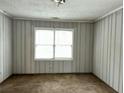 Bedroom featuring neutral-striped wallpaper and a well-lit window at 1846 North Ave, Atlanta, GA 30318