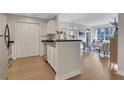 Open-concept kitchen with stainless steel appliances flows into a bright living space at 1101 Juniper Ne St # 619, Atlanta, GA 30309