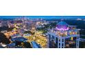 Stunning aerial view of the building and surrounding cityscape at twilight at 2828 Peachtree Nw Rd # P 3300, Atlanta, GA 30305