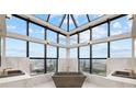 Beautifully designed bathroom featuring modern fixtures and stunning city views through large windows at 2828 Peachtree Nw Rd # P 3300, Atlanta, GA 30305
