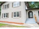 Close-up of the house's entrance, painted brick, and stairs at 4262 Hambrick Way, Stone Mountain, GA 30083