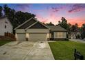 Charming single-Gathering home boasts a two-car garage, well-maintained lawn, and inviting curb appeal at 122 Riverbirch Way, Dallas, GA 30157