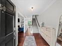 Bright entryway featuring hardwood floors, staircase, and stylish decor at 50 Mount Vernon Cir, Atlanta, GA 30338