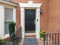 Inviting front entrance with black door, decorative trim, and 'Welcome' mat at 50 Mount Vernon Cir, Atlanta, GA 30338