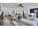 Open-concept living space with modern furnishings, a dining area, a kitchen, and stylish finishes throughout, perfect for Gathering at 230 Sheringham Dr, Roswell, GA 30076