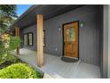 Close-up of home's front entry with a wooden door and decorative glass at 2661 Fleur De Lis Pl, Atlanta, GA 30360