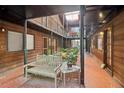 Charming courtyard featuring a bench, brick floors, plants and wooden walkways, offering a tranquil outdoor living space at 1284 Piedmont Ne Ave # 12, Atlanta, GA 30309