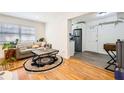 Cozy living room boasts natural light and a comfortable sofa, seamlessly transitioning to a modern kitchen at 1284 Piedmont Ne Ave # 12, Atlanta, GA 30309