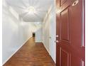 Inviting foyer with hardwood floors, high ceilings, and an open view to the living area at 1830 Broadway St, Decatur, GA 30035