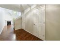 Bright entryway with hardwood floors, two-story ceiling, and a view of the living area at 1830 Broadway St, Decatur, GA 30035