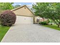 Attached two-car garage with extra-wide driveway at 117A Laguna Springs Dr, Woodstock, GA 30188