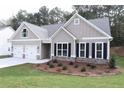 Charming one-story home with a two-car garage and stone accents at 14 Berkten Ct, Hiram, GA 30141